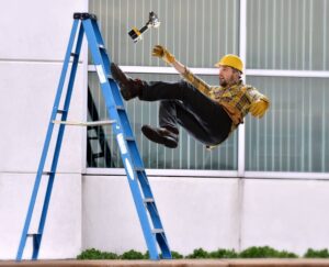 Worker falling from ladder.